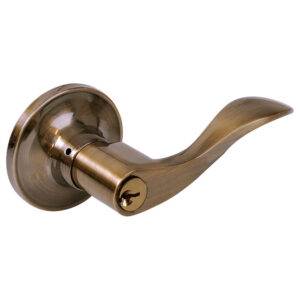 21MA Manija tubular curva función baño, latón antiguo, llave estándar, blíster. Lock